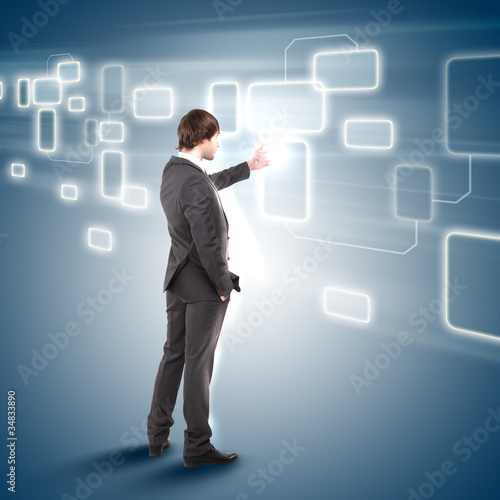 young man touches a virtual surface