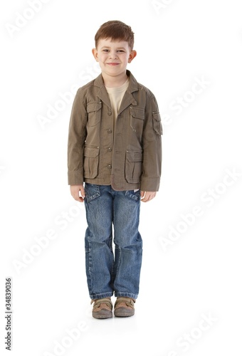 Little boy in autumn clothes smiling