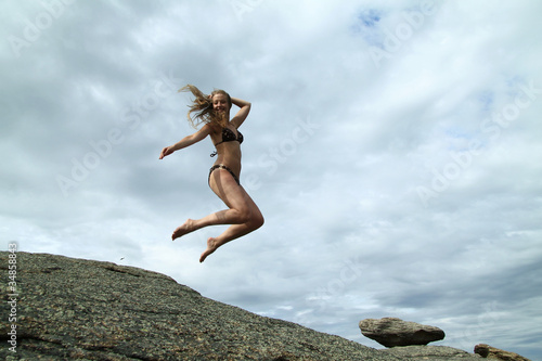 Jumping girl with long hair