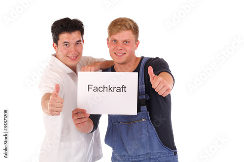 Fachkräfte mit Schild photo