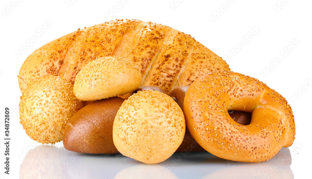 Tasty bread with sesame seeds and buns isolated on white