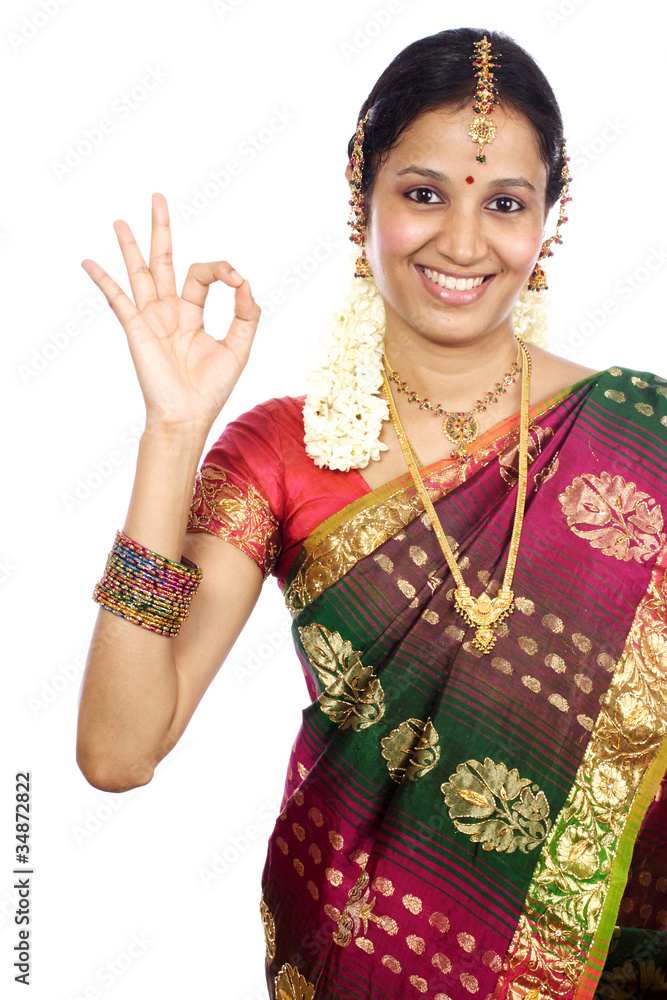 Traditional Indian Young woman making OK sign Traditional Indian Young woman making OK sign