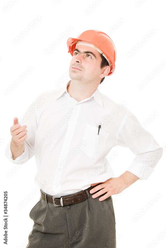 Businessman in a helmet looking up. Businessman in a helmet looking up.