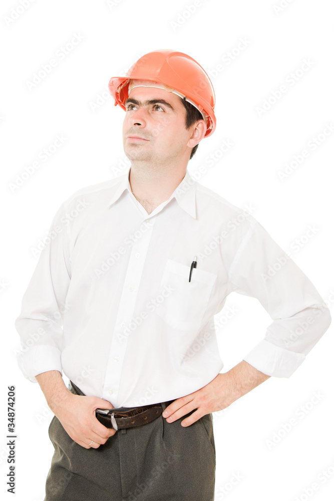 Businessman in a helmet looking up. Businessman in a helmet looking up.