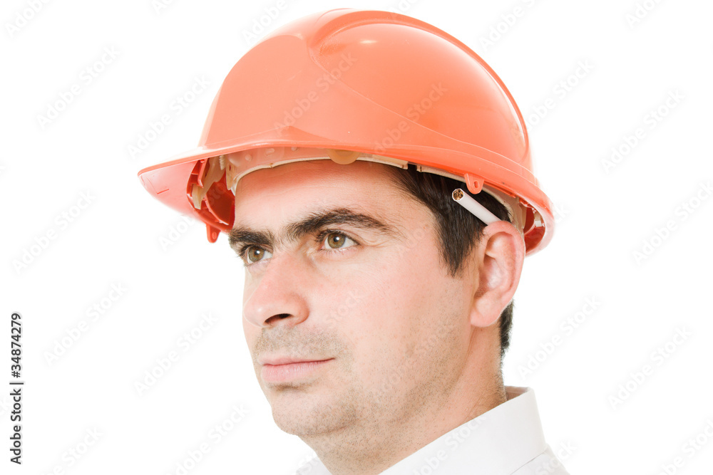 Businessman in a helmet with a cigarette. Businessman in a helmet with a cigarette.
