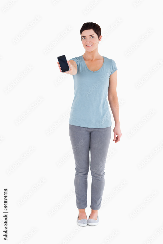 Smiling woman showing a smartphone Smiling woman showing a smartphone