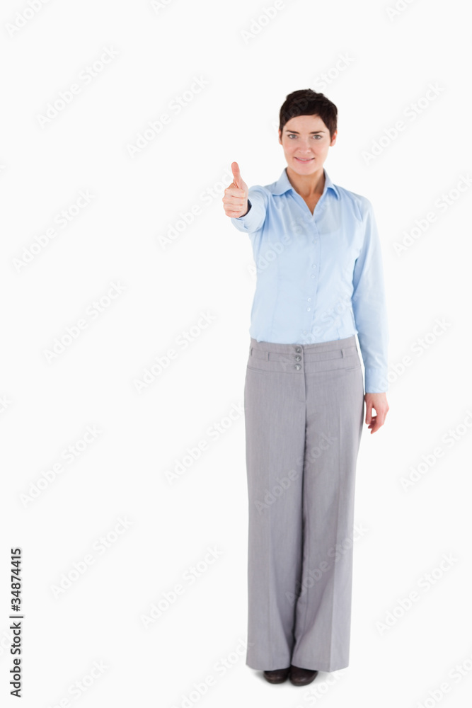 Office worker standing with her thumb up Office worker standing with her thumb up