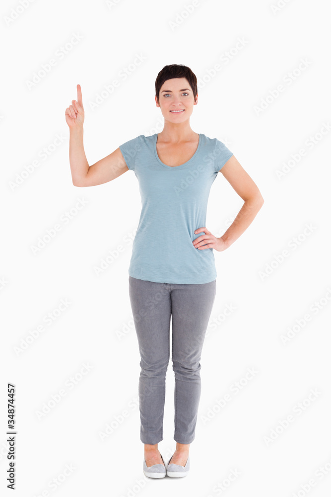 Good looking woman pointing at blank space Good looking woman pointing at blank space