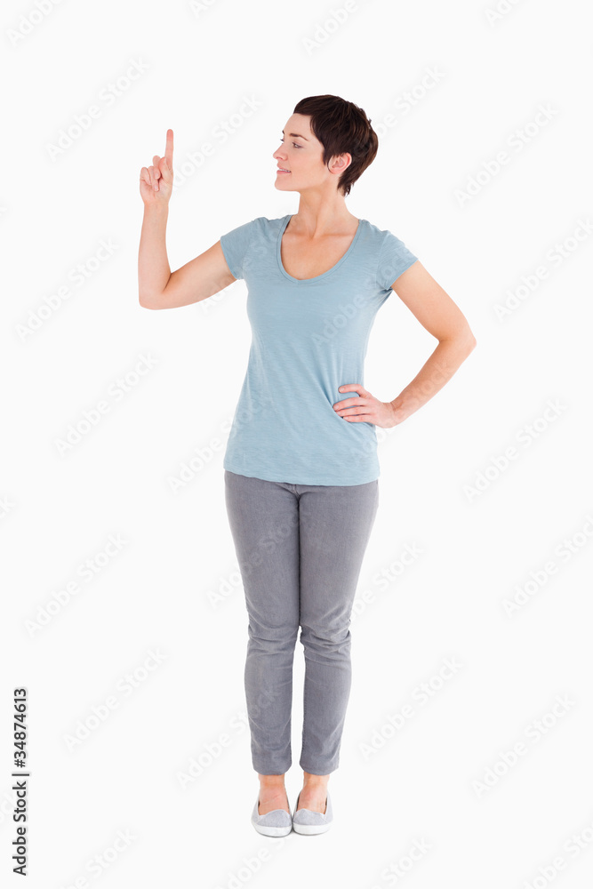 Good looking woman pointing at copy space Good looking woman pointing at copy space