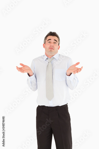 Tableau sur toile Portrait of a clueless businessman posing