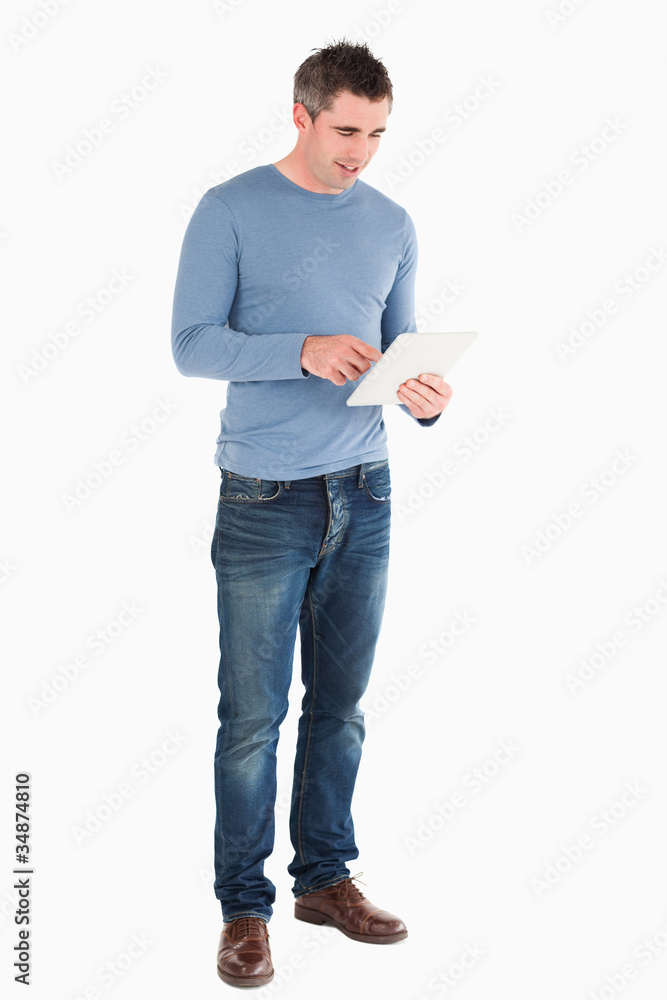 Handsome man using a tablet computer Handsome man using a tablet computer