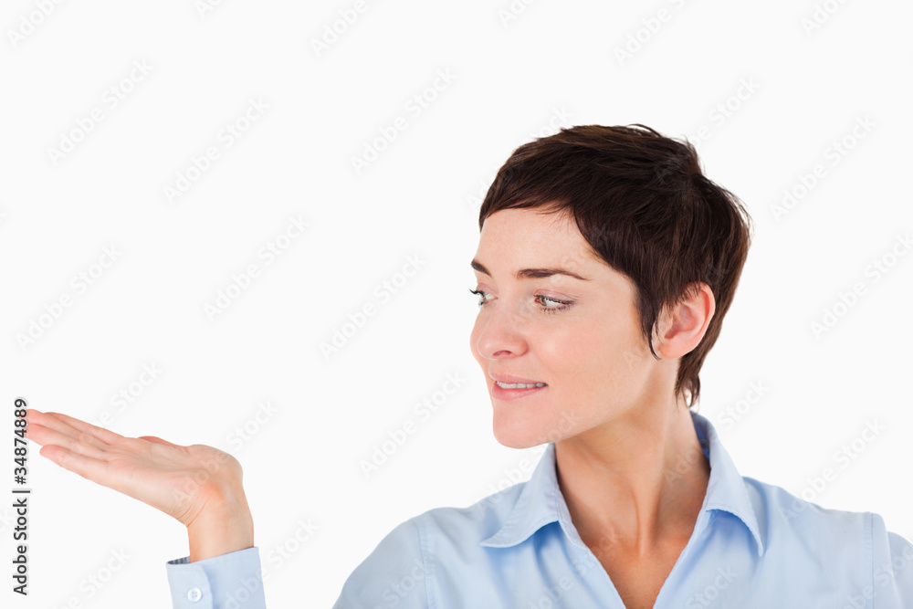 Close up of a serious woman showing a copy space Close up of a serious woman showing a copy space