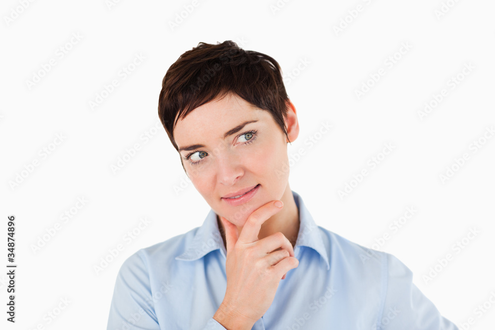Close up of a woman with her hand on her chin Close up of a woman with her hand on her chin