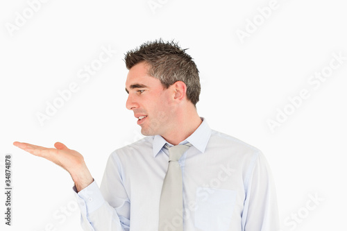 Smiling businessman looking at a copy space