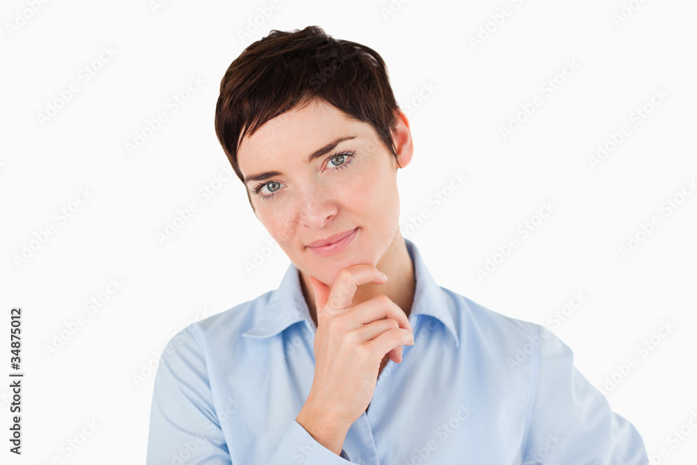 Close up of a businesswoman with her hand on her chin Close up of a businesswoman with her hand on her chin