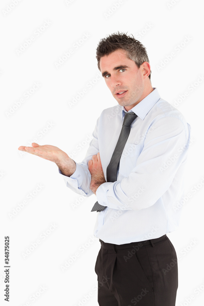 Portrait of a businessman showing a copy space Portrait of a businessman showing a copy space