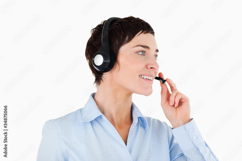Close up of a businesswoman using a headset Close up of a businesswoman using a headset