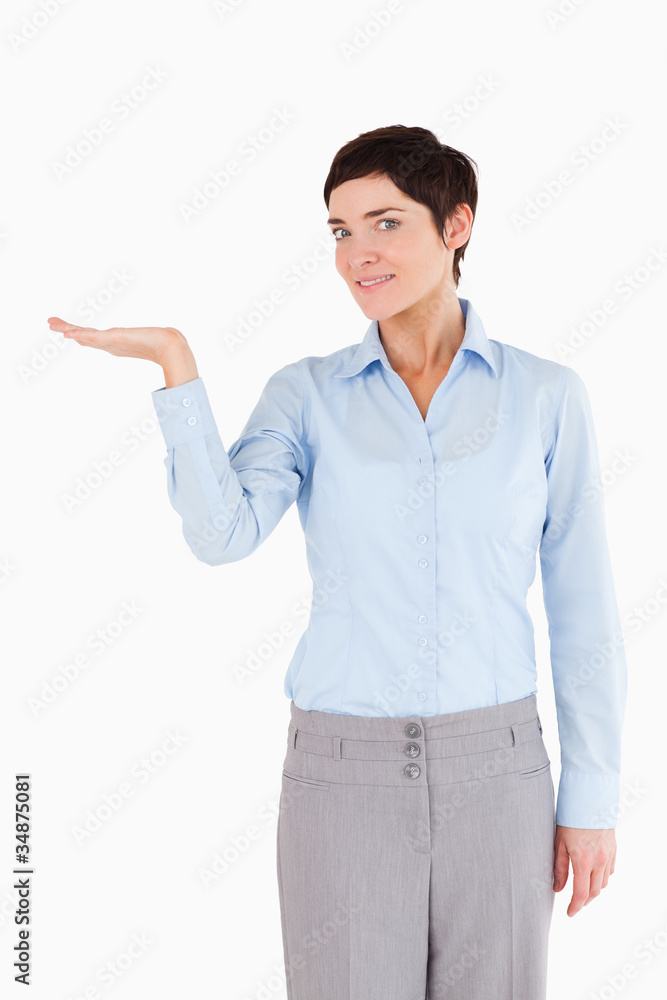 Businesswoman with hand open to show a copy space Businesswoman with hand open to show a copy space