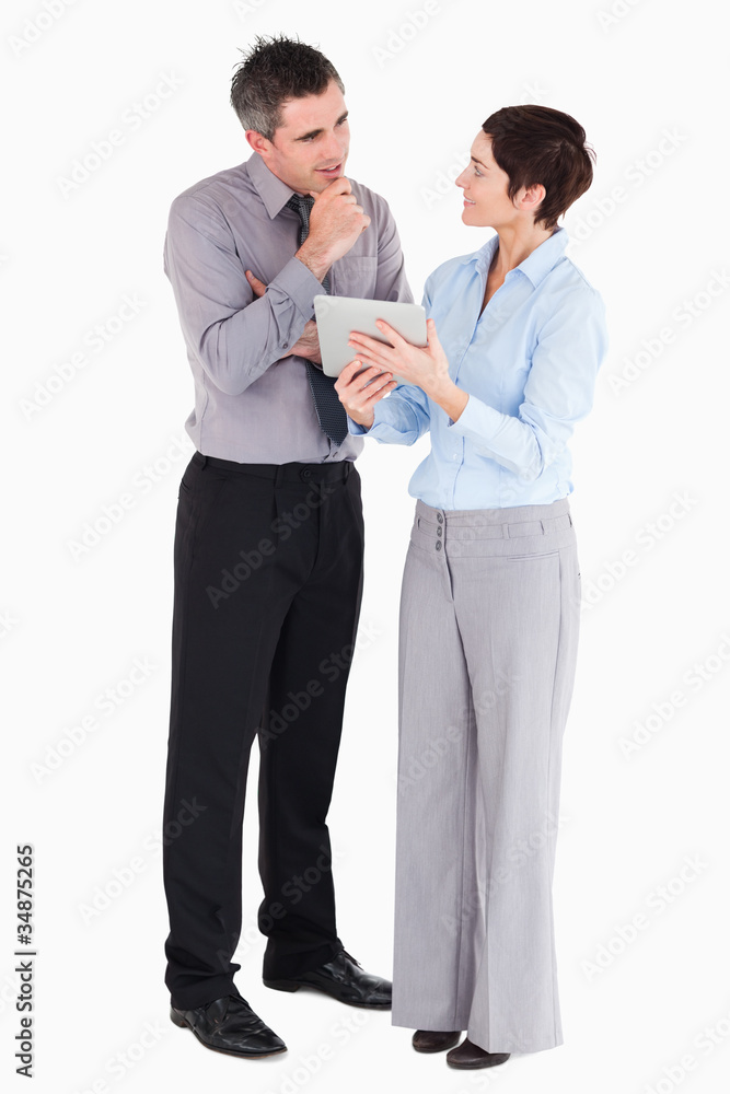 Coworkers looking at a tablet computer