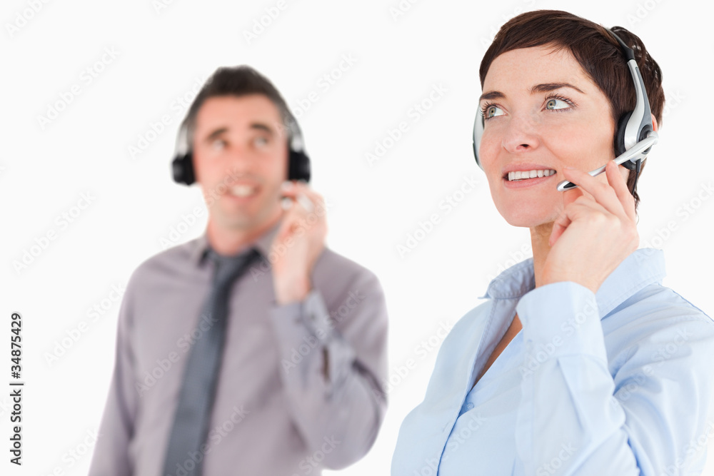 Close up of colleagues using headsets Close up of colleagues using headsets