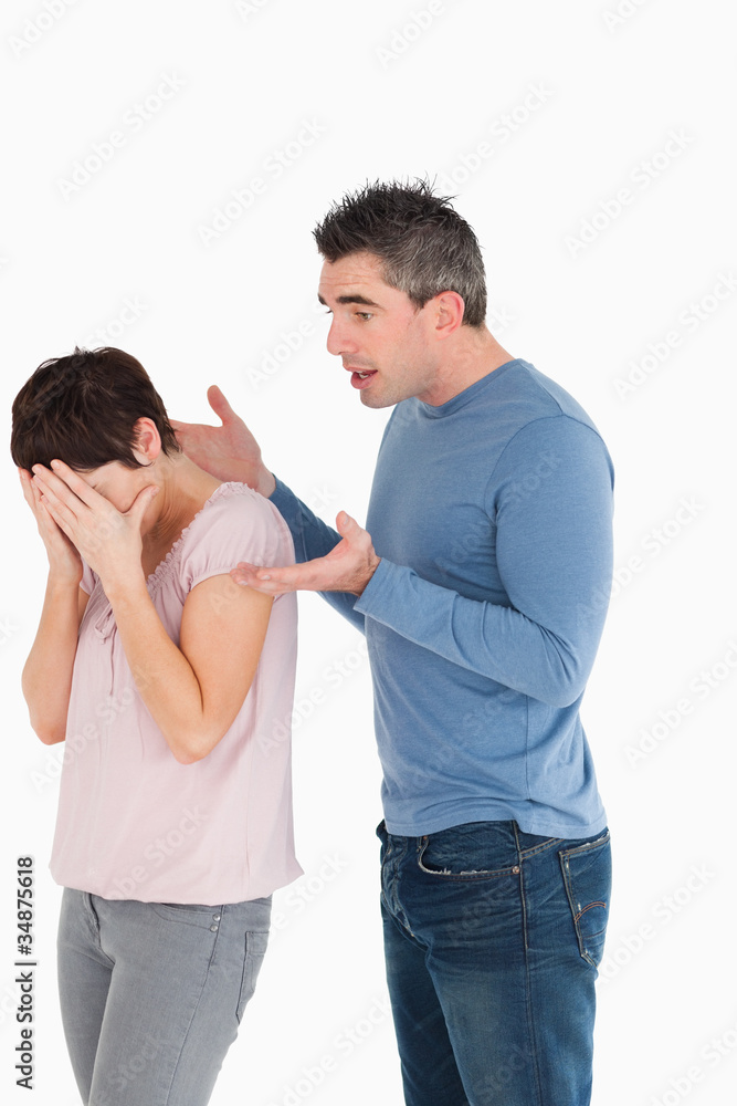 Woman crying while her husband is trying to explain himself Woman crying while her husband is trying to explain himself