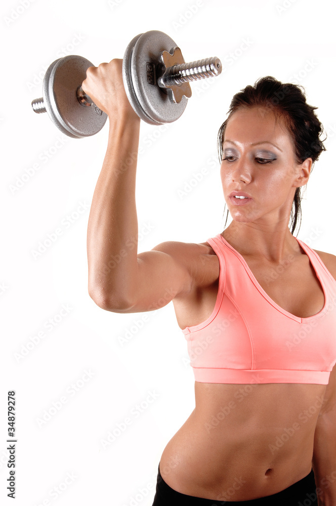 Fototapeta premium Girl lifting dumbbells.