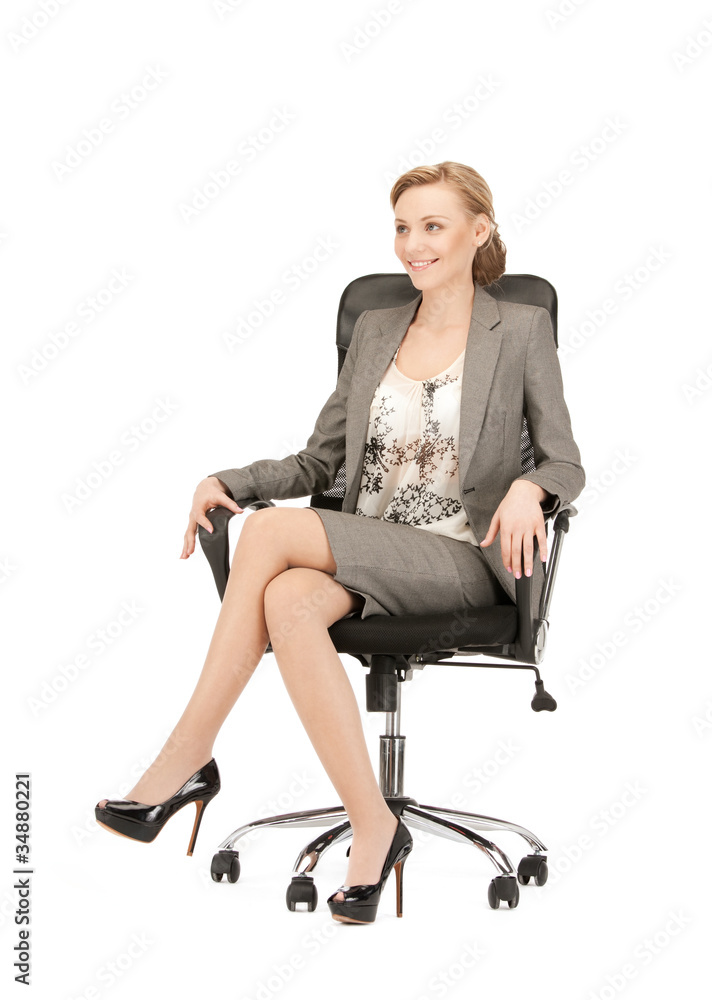 young businesswoman sitting in chair young businesswoman sitting in chair