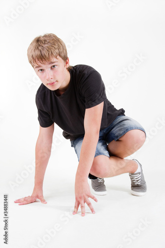 Teen b-boy posing on white background