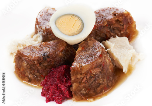Jellied meat with boiled egg and horseradish