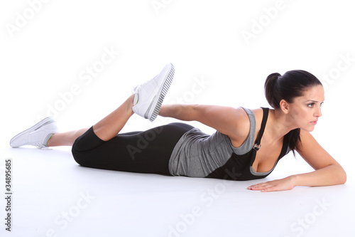 Beautiful young woman stretch exercising on floor