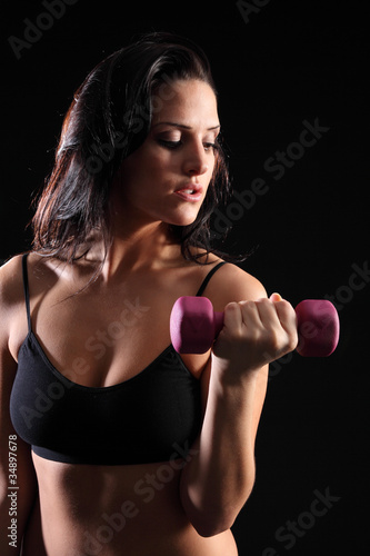 Beautiful woman bicep curl exercise in gym © Darrin Henry
