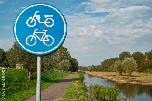 bike/moped road sign in dutch landscape