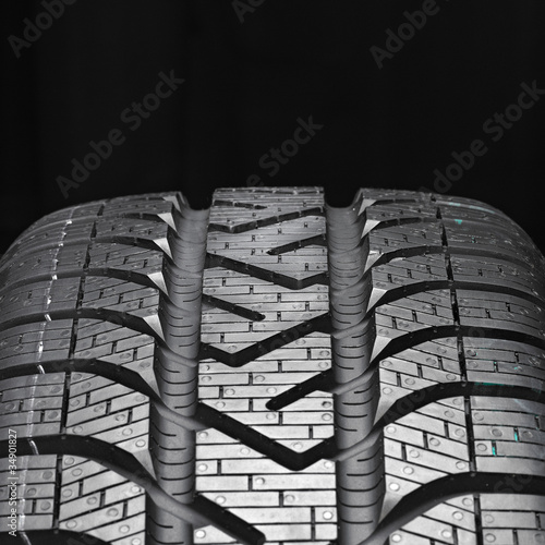 Close up of a winter tire on black background