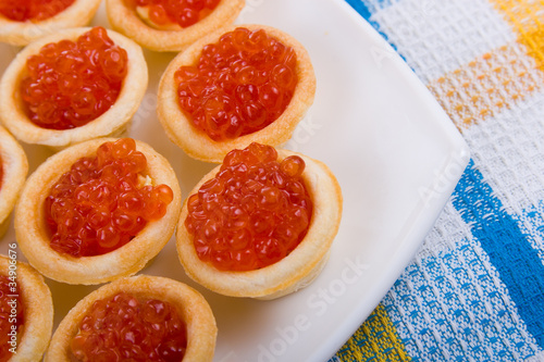 Tartlets with red caviar