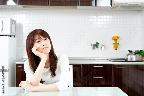 attractive asian woman in the kitchen