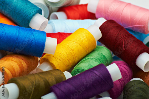 Multicolored spools of threads background