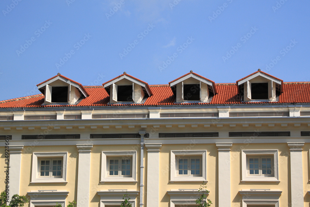 Gable on the roof townhouse in city.