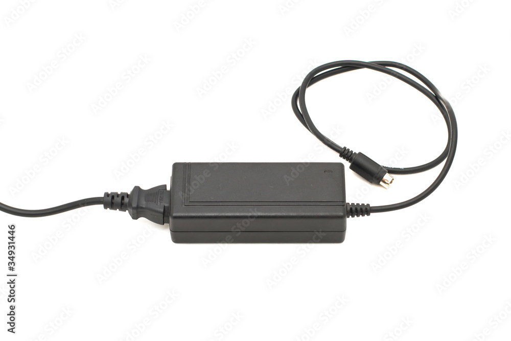 Power unit, cable and a connector isolated on white Power unit, cable and a connector isolated on white