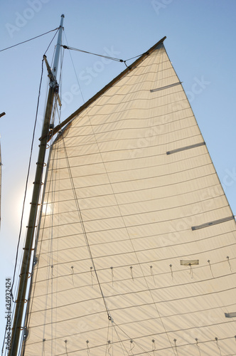 Mainsail and Wooden Mast of Schooner Sailboat