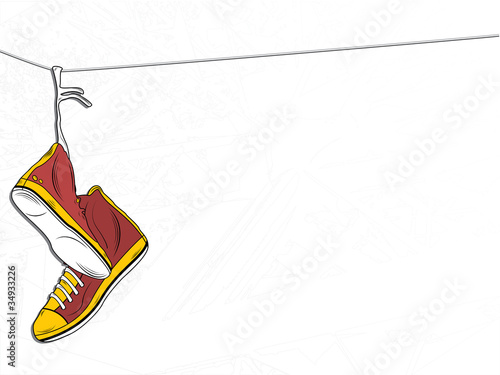 Sneakers Hanging on wire on White Background
