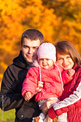 Happy family enjoying a autumn day at nature © Igor Stepovik