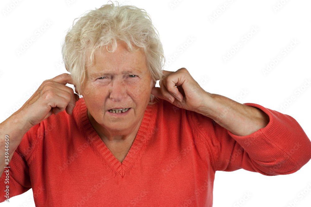 senior woman shut her ears on white background senior woman shut her ears on white background