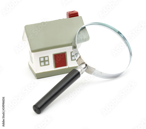 magnifying glass examining model home