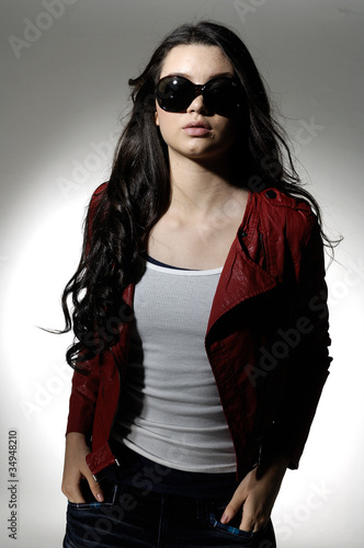 fashion model wearing modern sunglasses posing