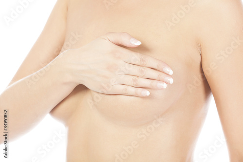 Breast cancer, woman holding her breast