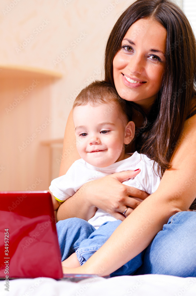 mother and son are using laptop mother and son are using laptop