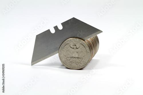 Stack of quarters cut by a razor blade