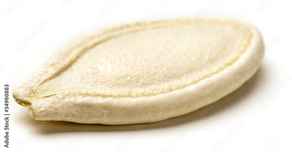 Pumpkin seed isolated on white background. Soft focus. Pumpkin seed isolated on white background. Soft focus.