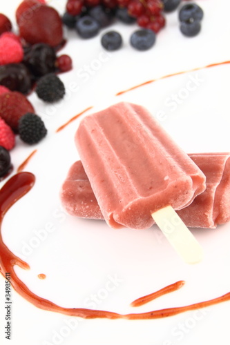 Two ice pops of berries