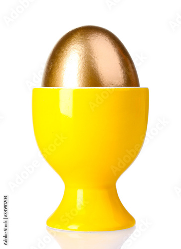 egg in yellow stand isolated on white